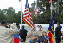 
			
				                                The Faison Boy Scout Troop 42 and Cub Scout Pack 42 color guard retires the colors following Sunday’s Veterans Day Service sponsored by Mount Olive VFW Post 9959 and American Legion Post 103 and held at the Mount Olive Veterans Memorial. The Scouts are, left to right, Mason Robertson, Clayton Tillman, and Eli Cox. (Steve Herring|mountolivetribune.com)
 
			
		