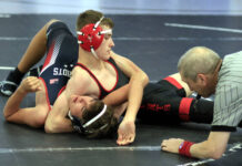 
			
				                                Southern Wayne’s Zach Sauls pins Tucker Sullivan from American Leadership Academy in 33 seconds during their 138-pound match Wednesday at the Sass-Holmes Memorial Duals hosted by Rosewood High School. (Rudy Coggins|mountolivetribune.com)
 
			
		