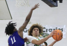 
			
				                                Spring Creek’s Nathan Jackson, right, goes up for a shot and gets fouled during a recent game. Jackson scored 18 points during the Gators’ road loss Thursday evening at Parrott Academy. (Rudy Coggins|mountolivetribune.com)
 
			
		