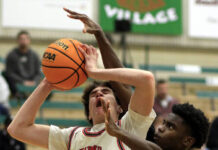 
			
				                                Wayne Christian’s Justin Weaver (35) gets fouled from behind by a Rosewood defender during first-period action Friday afternoon. (Rudy Coggins|mountolivetribune.com)
 
			
		