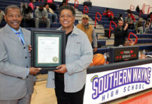 
			
				                                Leora “Sam” Jones, right, basketball All-American and three-time U.S. Olympian, was presented The Order of the Long Leaf Pine, during halftime of the Southern Wayne High Schools girls basketball game Wednesday night. Mount Olive Mayor Jerome Newton presented the honor to Jones, a longtime friend and neighbor. Bheind Jones is Milton Whitfield who nominated her for the honor. The award is the highest honor presented by the governor for persons who have made significant contributions to the state and their communities through their exemplary service and exceptional accomplishments. (Steve Herring|mountolivetribune.com)
 
			
		